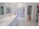 This bathroom has double sinks, a standing shower, and a walk-in closet at 4211 Little Owl Ln, Kissimmee, FL 34746