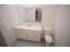 This bathroom has a white vanity with solid surface counter and tiled shower and tub at 4211 Little Owl Ln, Kissimmee, FL 34746