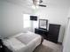 Furnished bedroom with carpet flooring, a ceiling fan, and a dresser at 4211 Little Owl Ln, Kissimmee, FL 34746