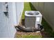 This exterior shot displays the home's air conditioning unit at 4211 Little Owl Ln, Kissimmee, FL 34746