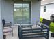 View of the cozy patio, complete with comfortable seating and a sliding glass door entrance at 4211 Little Owl Ln, Kissimmee, FL 34746