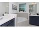 Elegant bathroom features dual sinks, a soaking tub, and modern finishes at 4507 Lions Gate Ave, Clermont, FL 34711