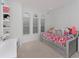 Charming bedroom featuring playful decor, natural light, and ample space for activities at 4507 Lions Gate Ave, Clermont, FL 34711
