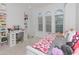 Bright bedroom featuring playful decor, ample natural light, and a comfortable layout at 4507 Lions Gate Ave, Clermont, FL 34711