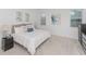 Cozy bedroom featuring neutral tones, plush carpeting, and multiple windows for ample natural light at 4507 Lions Gate Ave, Clermont, FL 34711