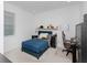 This bedroom features a comfy bed, a sleek desk, and ample shelving space at 4507 Lions Gate Ave, Clermont, FL 34711