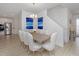 Elegant dining room with seating for eight, adjacent to the kitchen, with ample natural light at 4507 Lions Gate Ave, Clermont, FL 34711