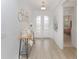 Bright entryway featuring high ceilings, light floors, and patterned glass double doors at 4507 Lions Gate Ave, Clermont, FL 34711