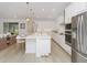 Spacious kitchen featuring a central island, stainless steel appliances, and seamless flow to living area at 4507 Lions Gate Ave, Clermont, FL 34711