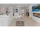 Open-concept living room boasts light floors, comfortable seating, and seamless flow to the kitchen at 4507 Lions Gate Ave, Clermont, FL 34711