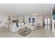 Spacious, light-filled living area connects to a modern kitchen and dining space, perfect for entertaining at 4507 Lions Gate Ave, Clermont, FL 34711