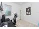 Bright home office with a desk, modern chair, and a large window at 4507 Lions Gate Ave, Clermont, FL 34711