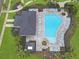 Aerial shot of the community pool area, highlighting the pool's shape and lounge chairs at 4507 Lions Gate Ave, Clermont, FL 34711