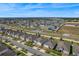 An aerial view of a residential area with well-maintained lawns and paved streets on a clear day at 485 Disa Dr, Davenport, FL 33837