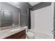 Bathroom with granite-topped vanity and shower-tub combination at 485 Disa Dr, Davenport, FL 33837