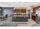 Modern kitchen with granite countertops, stainless steel appliances, an island and dark cabinetry at 485 Disa Dr, Davenport, FL 33837