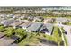 Aerial view of the home showing the backyard, landscaping, and the surrounding neighborhood with other houses at 4918 Drawdy Ct, St Cloud, FL 34772