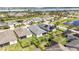 The aerial view showcases the home's location within a community with lush landscaping and nearby lake amenities at 4918 Drawdy Ct, St Cloud, FL 34772