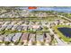 The aerial view showcases the home's location within a community with lush landscaping and nearby lake amenities at 4918 Drawdy Ct, St Cloud, FL 34772