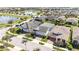 An aerial view showing a house and neighborhood featuring well-maintained homes, landscaping, and community ponds at 4918 Drawdy Ct, St Cloud, FL 34772