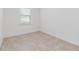 Neutral tone bedroom featuring tile floors and a window for natural light at 4918 Drawdy Ct, St Cloud, FL 34772