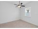 Neutral tone bedroom featuring carpet, ceiling fan and a window for natural light at 4918 Drawdy Ct, St Cloud, FL 34772
