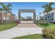 Welcoming entrance to Emerson Plaza framed by stone pillars, manicured landscaping, and views of community amenities at 4918 Drawdy Ct, St Cloud, FL 34772