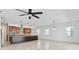 Open floor plan featuring kitchen with granite countertops, wooden cabinets and stainless steel appliances at 4918 Drawdy Ct, St Cloud, FL 34772