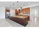 Spacious kitchen featuring a large island, granite countertops, stainless steel appliances, and custom cabinetry at 4918 Drawdy Ct, St Cloud, FL 34772