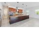 Bright kitchen features granite countertops, wooden cabinets and stainless steel appliances at 4918 Drawdy Ct, St Cloud, FL 34772