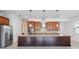 Bright kitchen features granite countertops, a stainless steel fridge, and tile backsplash at 4918 Drawdy Ct, St Cloud, FL 34772