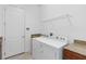 Bright laundry room featuring granite countertops and a full size washer and dryer at 4918 Drawdy Ct, St Cloud, FL 34772