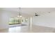Spacious living room with ceiling fan and sliding glass doors to patio area at 4918 Drawdy Ct, St Cloud, FL 34772