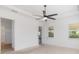 Bright main bedroom with a ceiling fan, neutral walls, and carpet flooring, filled with lots of natural light at 4918 Drawdy Ct, St Cloud, FL 34772