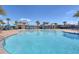 Beautiful community pool with cabanas and lounge chairs for residents to enjoy on a sunny day at 4918 Drawdy Ct, St Cloud, FL 34772