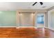 Inviting living room featuring hardwood floors, neutral walls, and a clear view to a secondary room at 555 Presido Park Pl, Kissimmee, FL 34759