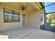 Outdoor patio featuring a ceiling fan and screened in area, perfect for enjoying the outdoors at 555 Presido Park Pl, Kissimmee, FL 34759