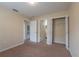 Neutral bedroom with large closet, carpet, and an ensuite bathroom at 635 Lake Marion Golf Resort, Kissimmee, FL 34759
