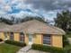 Charming single-story home with a tile roof, well-kept landscaping, and a welcoming entrance at 635 Lake Marion Golf Resort, Kissimmee, FL 34759