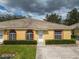The house is a single-story home with a tile roof and manicured landscaping at 635 Lake Marion Golf Resort, Kissimmee, FL 34759