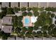 Aerial view of the community pool, gazebo, and surrounding neighborhood at 7128 Red Lantern Dr # 0, Harmony, FL 34773