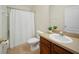Bathroom with single sink vanity, toilet, and shower with curtain at 7128 Red Lantern Dr # 0, Harmony, FL 34773