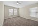 Spacious bedroom featuring plush carpet and windows providing natural light at 7128 Red Lantern Dr # 0, Harmony, FL 34773
