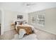 Bright bedroom featuring plush carpet, ceiling fan, and two windows providing natural light at 7128 Red Lantern Dr # 0, Harmony, FL 34773