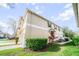 Exterior view of townhome showing landscaping at 7128 Red Lantern Dr # 0, Harmony, FL 34773