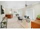 Spacious living area with a TV, comfortable seating, and an open layout connecting to the dining and kitchen areas at 7128 Red Lantern Dr # 0, Harmony, FL 34773