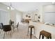 Open-concept living space features dining area, cozy seating, and neutral tones for a bright and airy feel at 7128 Red Lantern Dr # 0, Harmony, FL 34773