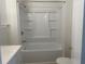 Clean and bright bathroom featuring a shower-tub combination and modern fixtures at 736 Nw 31St Ct, Winter Haven, FL 33881