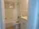 Bathroom with tub, updated toilet and vanity at 736 Nw 31St Ct, Winter Haven, FL 33881