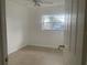Bedroom featuring tile floors, a ceiling fan, and natural light from the window at 736 Nw 31St Ct, Winter Haven, FL 33881